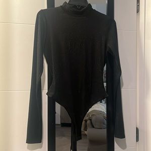 Glittery black turtleneck bodysuit